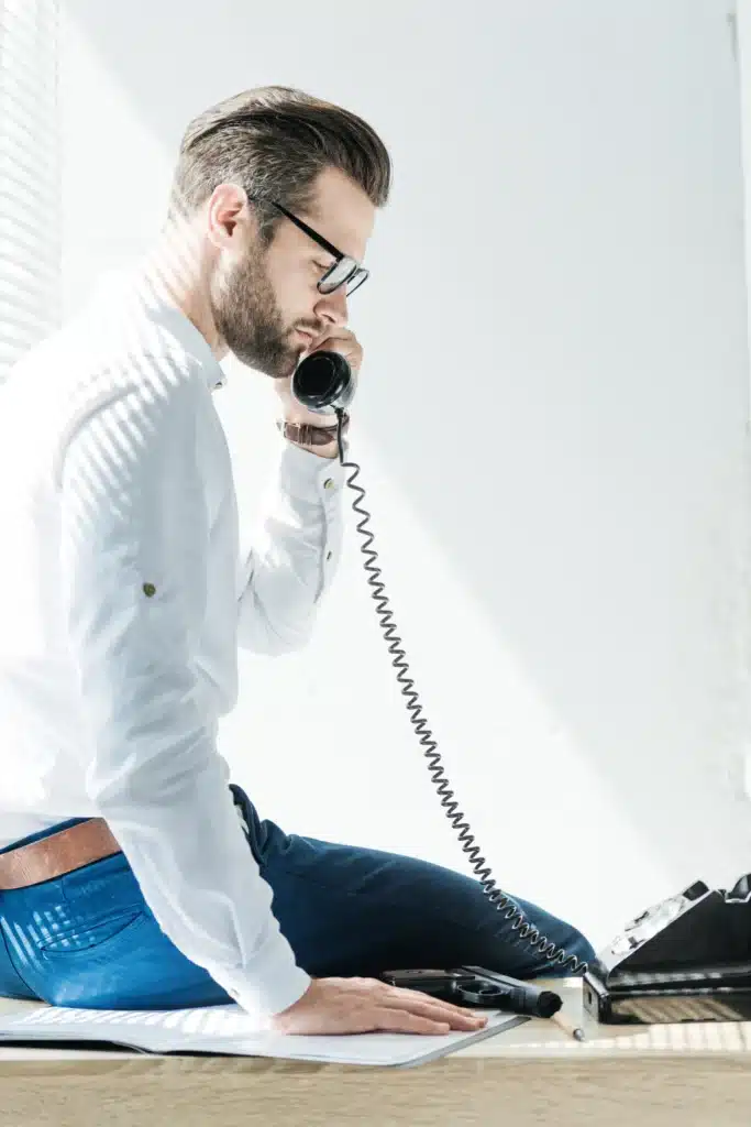 bearded businessman talking on rotary phone while 2023 11 27 05 05 53 utc