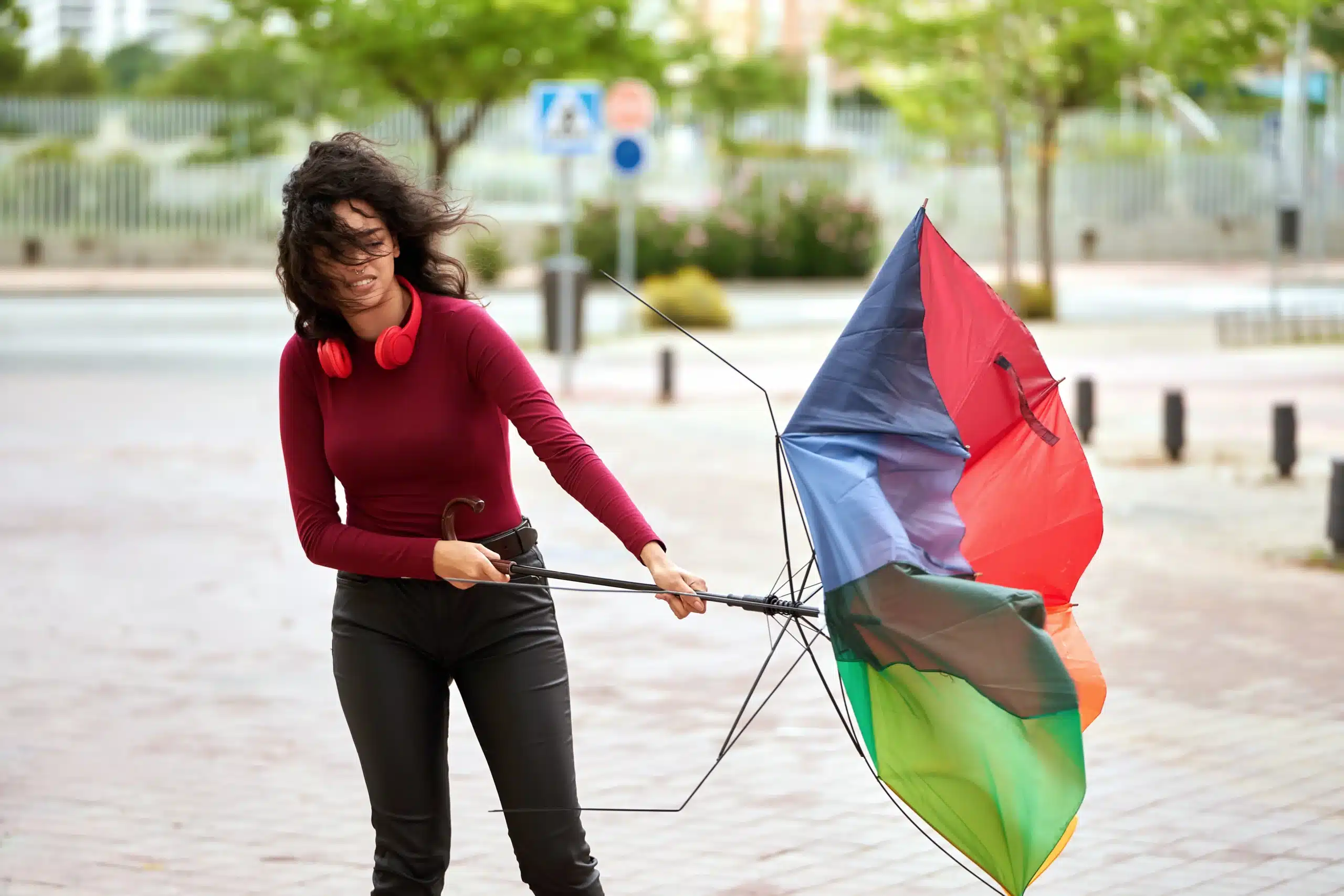 woman with a broken umbrella outdoors 2023 11 27 04 52 28 utc scaled